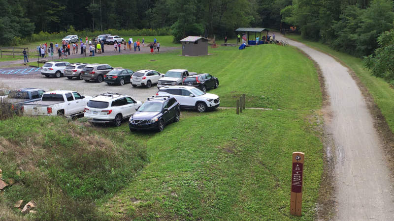 Parking lot with cars and people at Garrett