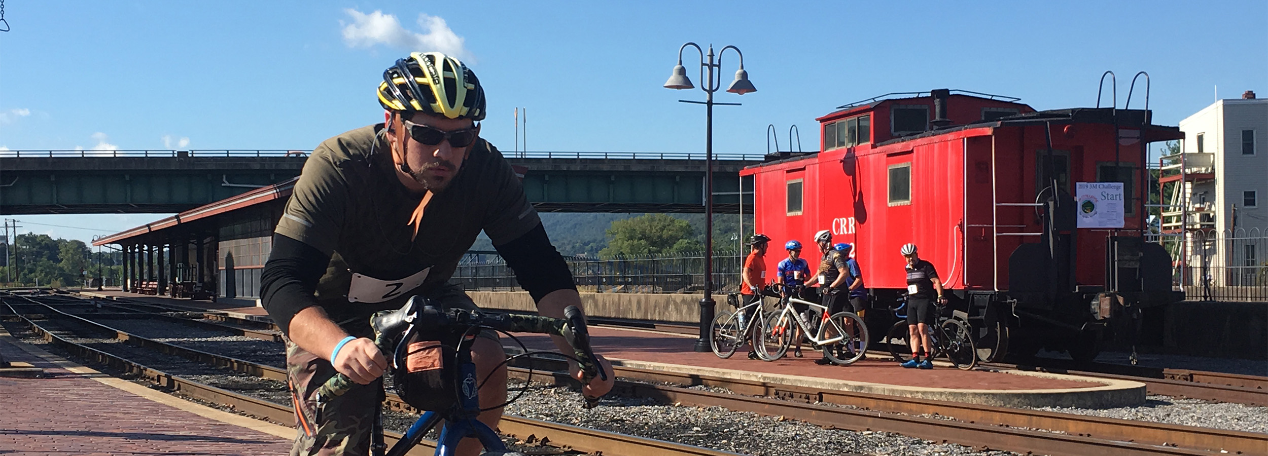 Cyclist passing Cumberland Caboose