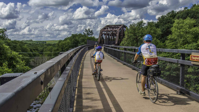 Cyclists biking over Keystone Viaduct